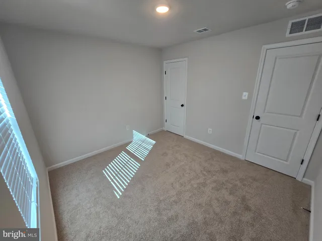 a bathroom with a double vanity sink and mirror