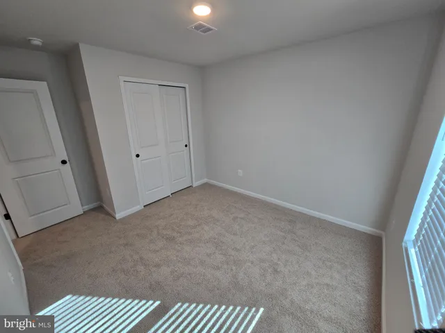 a bathroom with a double vanity sink toilet and shower