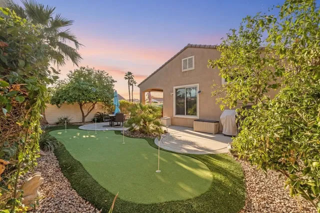 a view of a backyard with potted plants