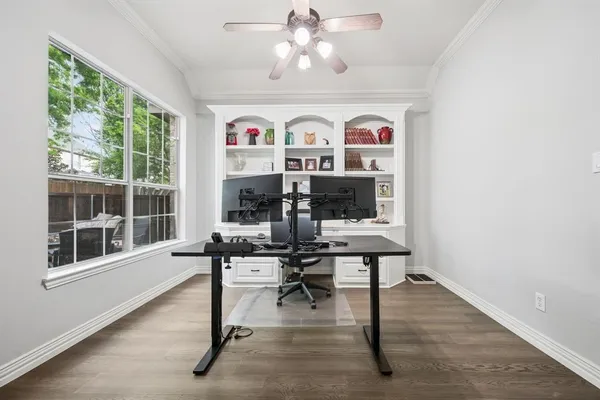 a view of a livingroom with furniture window and wooden floor