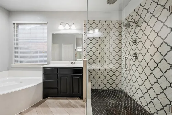a bathroom with a sink and a bathtub