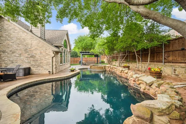 a view of swimming pool with a patio
