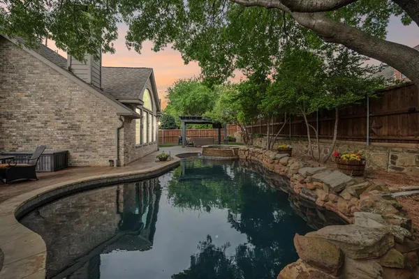 a view of swimming pool from a lake view