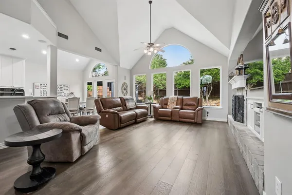 a living room with furniture and a chandelier