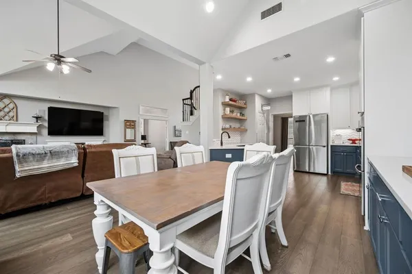 a view of a dining room with furniture and wooden floor