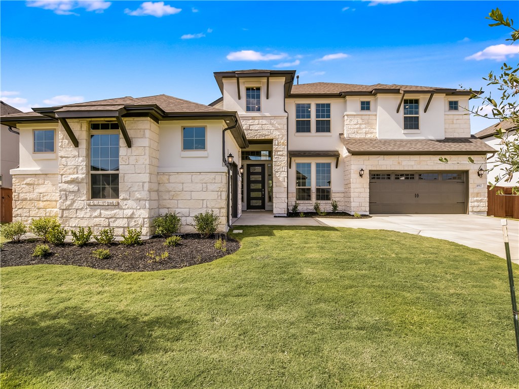 4912 Bruco Lane Round Rock, TX 78665 - Photo 1 of 1 a front view of a house with a yard