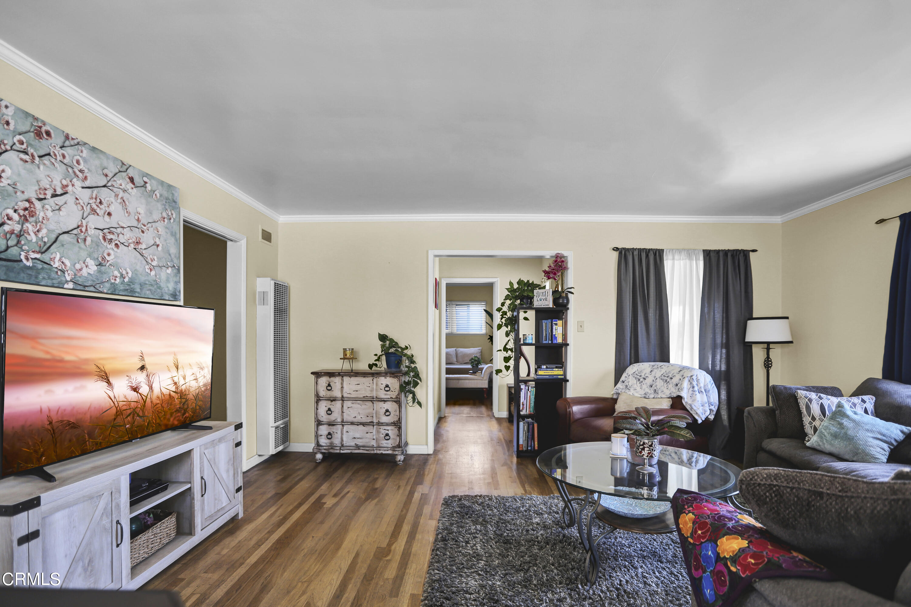 930 Doris Avenue Oxnard, CA 93030 - Photo 4 of 16 a living room with furniture and a flat screen tv