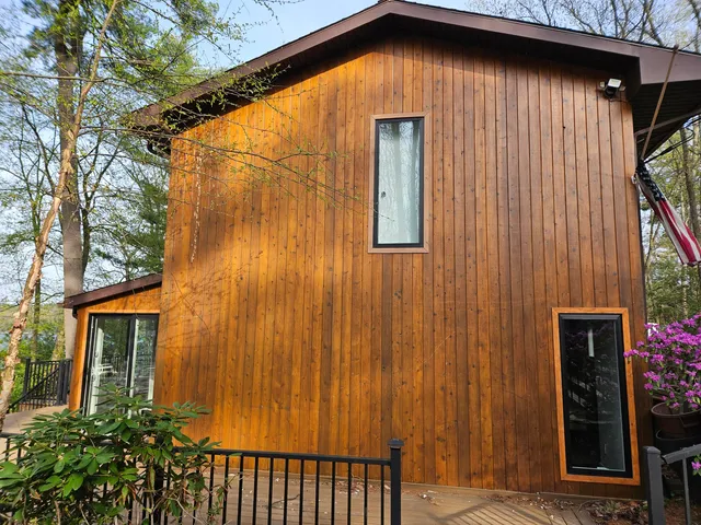 a view of outdoor space with deck and hardwood