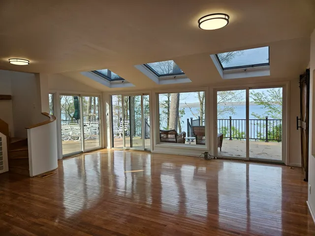 a living room with furniture rug and a flat screen tv
