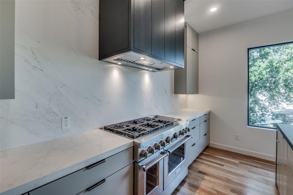 4525 Weldon Street Dallas, TX 75204 - Photo 14 of 40 a kitchen with a stove and a window