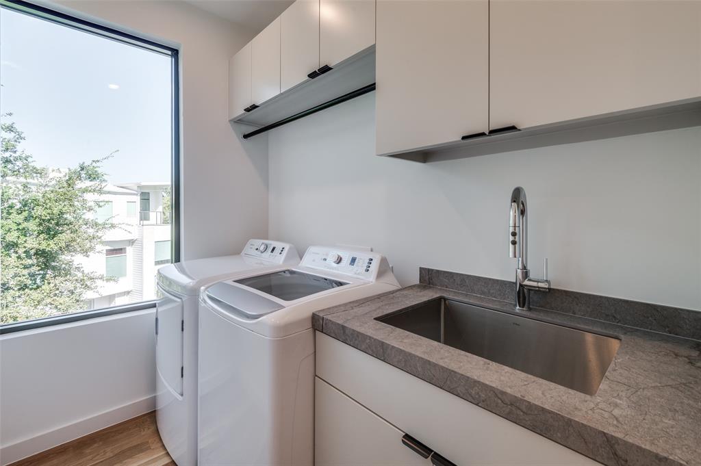 4525 Weldon Street Dallas, TX 75204 - Photo 18 of 40 a utility room with dryer and washer