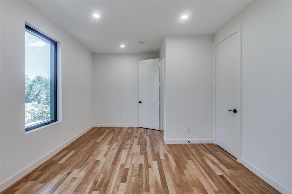 4525 Weldon Street Dallas, TX 75204 - Photo 20 of 40 a view of room with window and hardwood floor