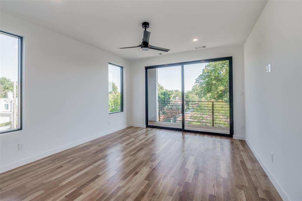 4525 Weldon Street Dallas, TX 75204 - Photo 24 of 40 a view of an empty room with wooden floor and a window