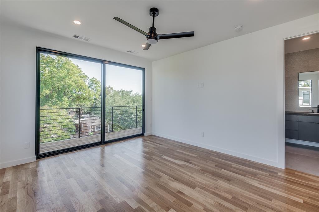 4525 Weldon Street Dallas, TX 75204 - Photo 25 of 40 a view of an empty room with wooden floor and a window