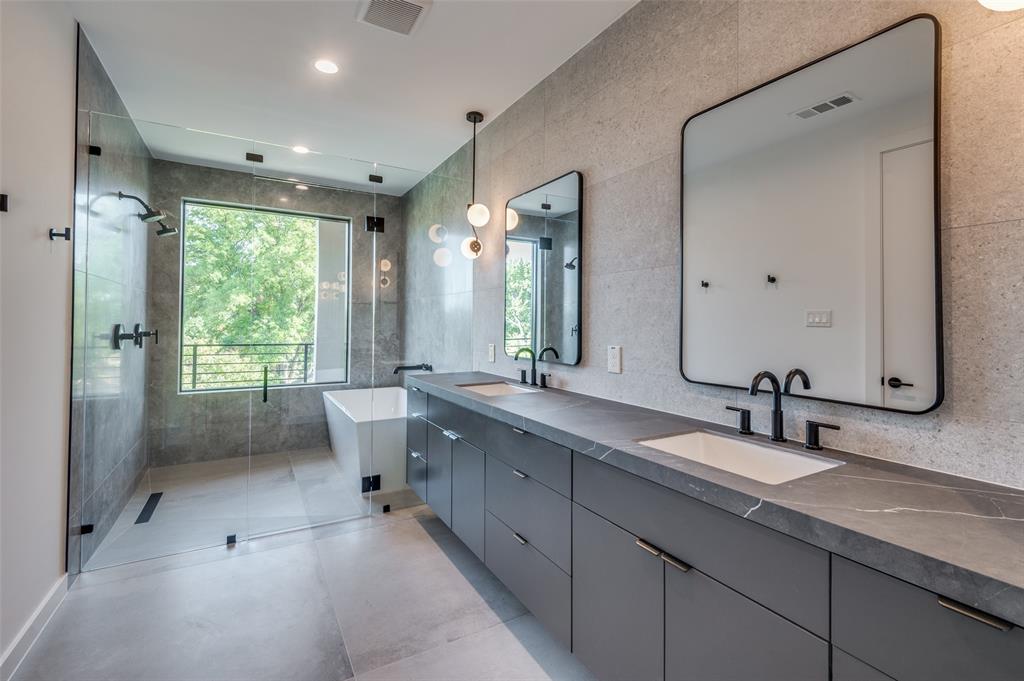 4525 Weldon Street Dallas, TX 75204 - Photo 26 of 40 a bathroom with double vanity sink a mirror and a shower
