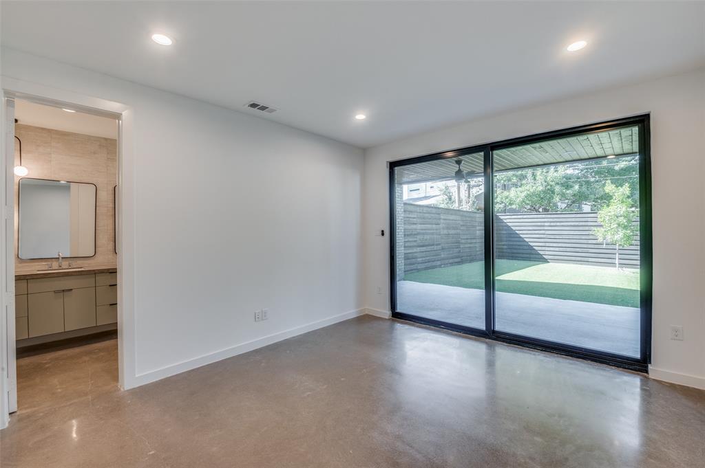 4525 Weldon Street Dallas, TX 75204 - Photo 3 of 40 an empty room with floor to ceiling windows and an outdoor view