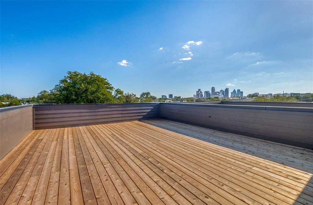 4525 Weldon Street Dallas, TX 75204 - Photo 28 of 40 a view of balcony with wooden floor and city view