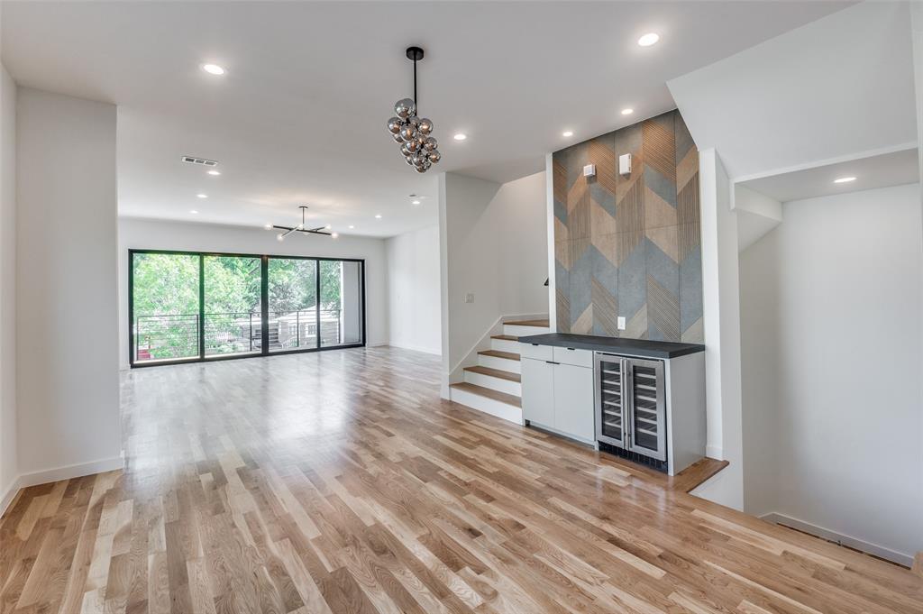 4525 Weldon Street Dallas, TX 75204 - Photo 5 of 40 an empty room with wooden floor and windows