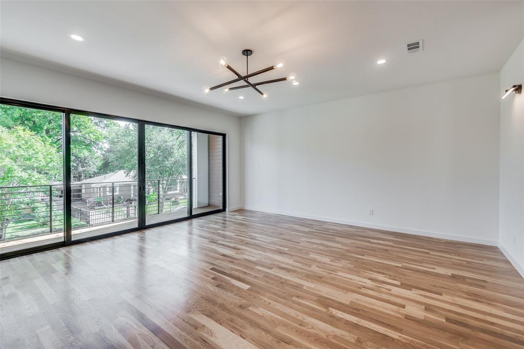 4525 Weldon Street Dallas, TX 75204 - Photo 8 of 40 a view of room with window and wooden floor