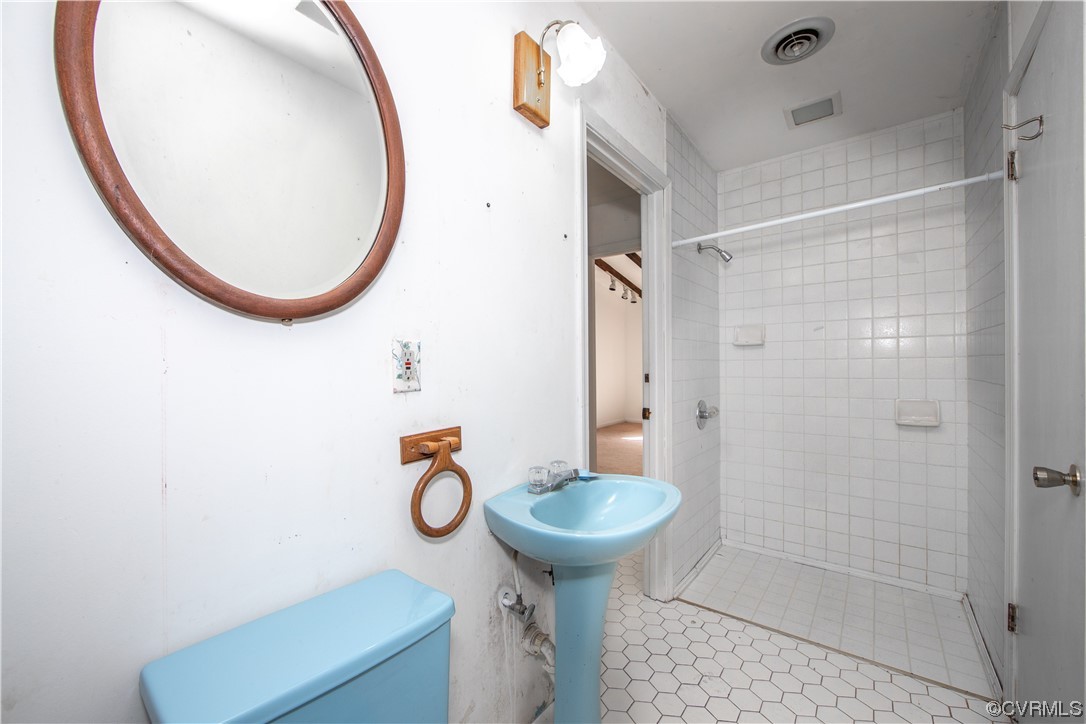 4586 Broad St Road Gum Spring, VA 23065 - Photo 15 of 23 a bathroom with a sink toilet and shower