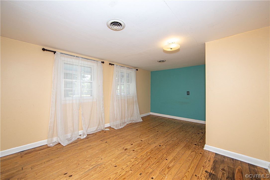 4586 Broad St Road Gum Spring, VA 23065 - Photo 19 of 23 an empty room with wooden floor and windows