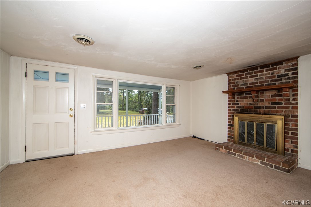 4586 Broad St Road Gum Spring, VA 23065 - Photo 2 of 23 a view of empty room with floor to ceiling window and fireplace