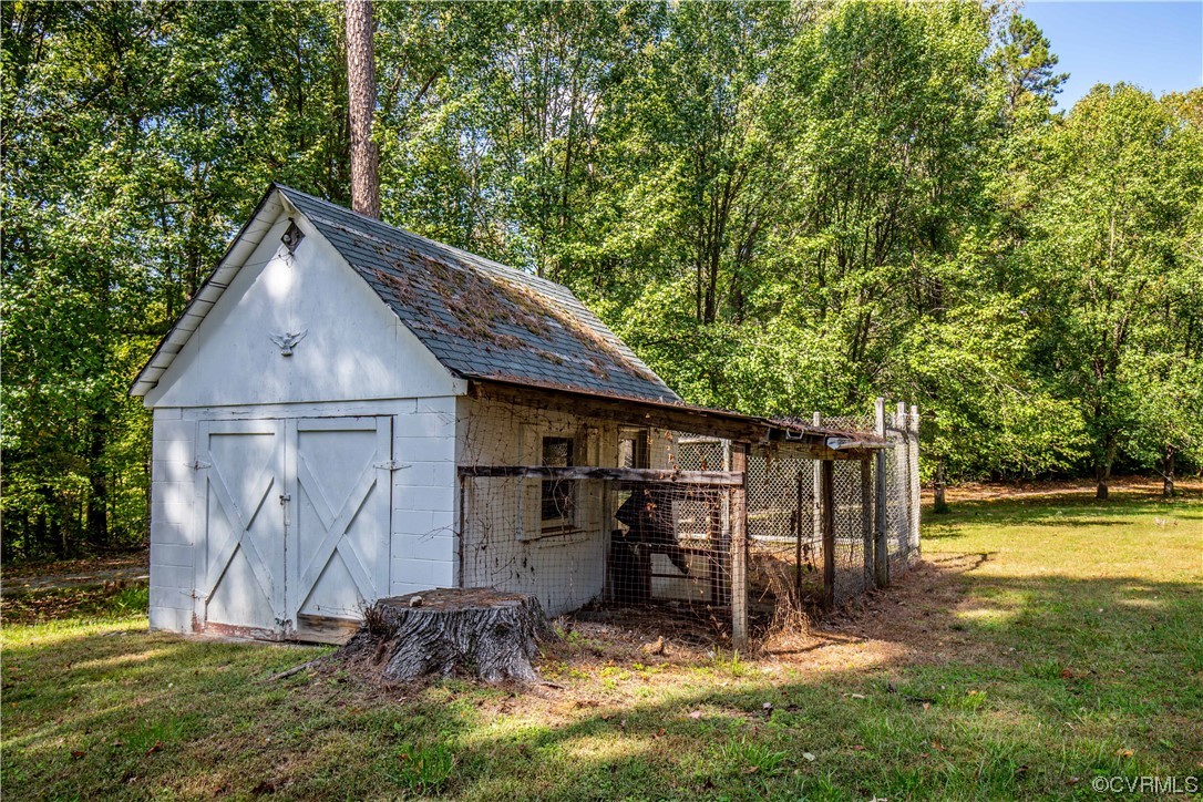 4586 Broad St Road Gum Spring, VA 23065 - Photo 9 of 23 a view of a backyard with a tree