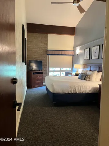 a bedroom with bed and window