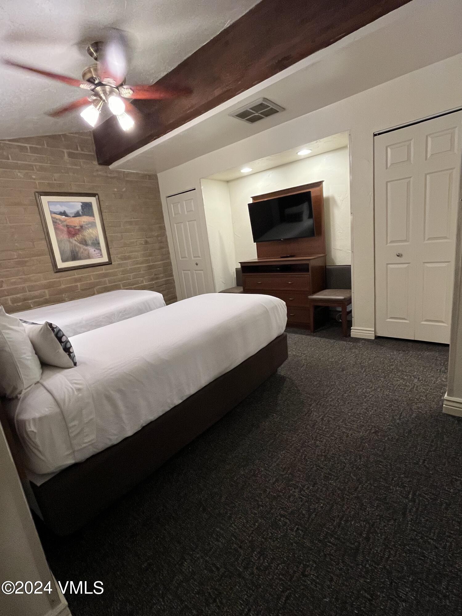 1020 Vail View Drive, Unit 141139 Vail, CO 81657 - Photo 7 of 20 a bedroom with a bed and a television