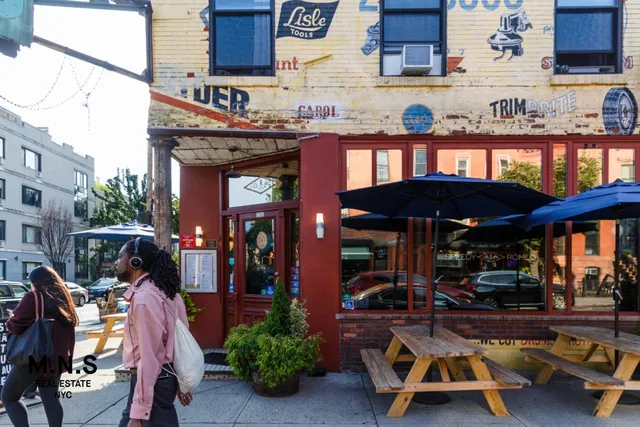 a view of a cafe with sitting area