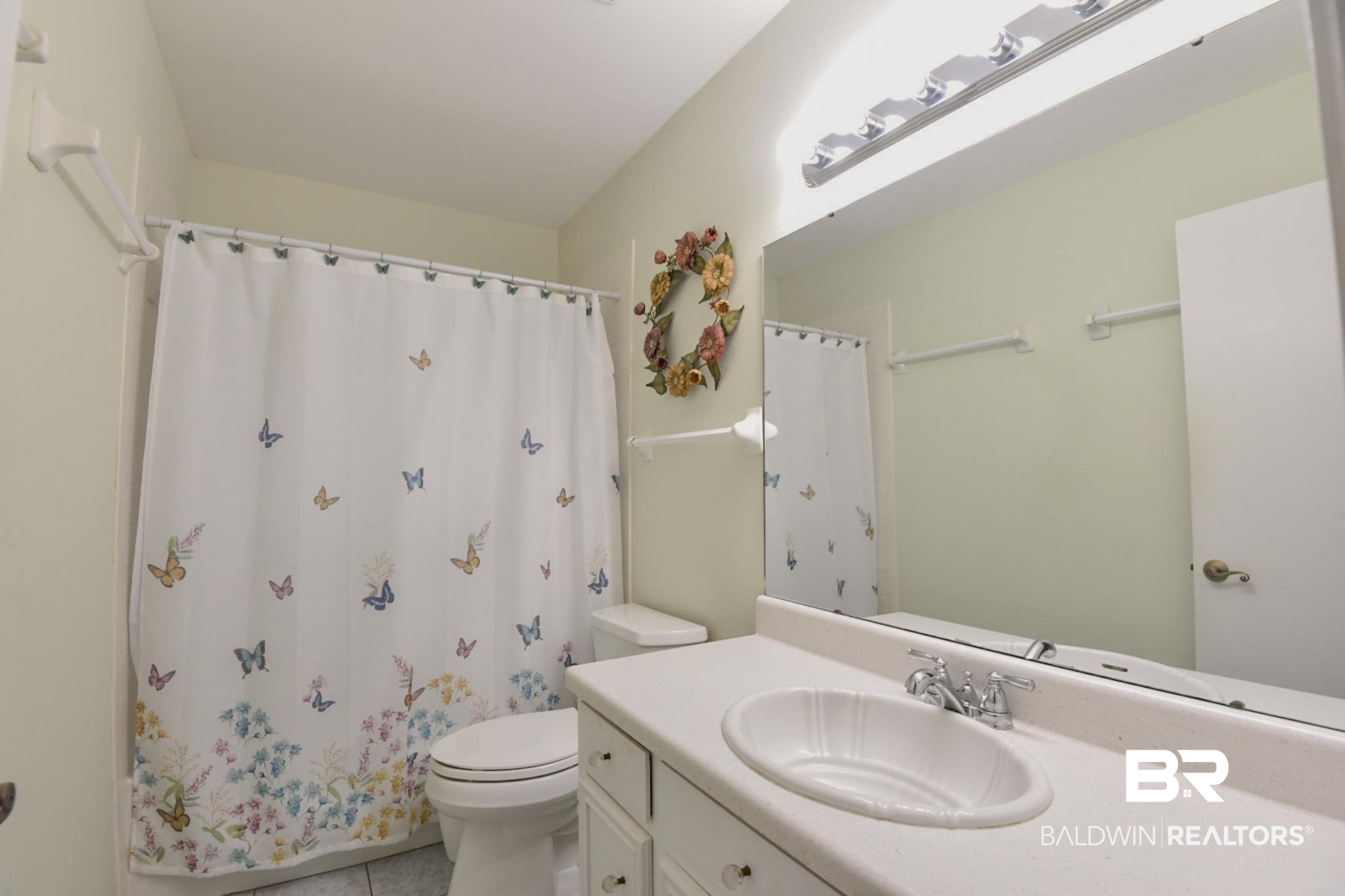 90 Paddock Drive Fairhope, AL 36532 - Photo 19 of 23 Full bathroom featuring a shower with shower curtain, light tile patterned flooring, and vanity