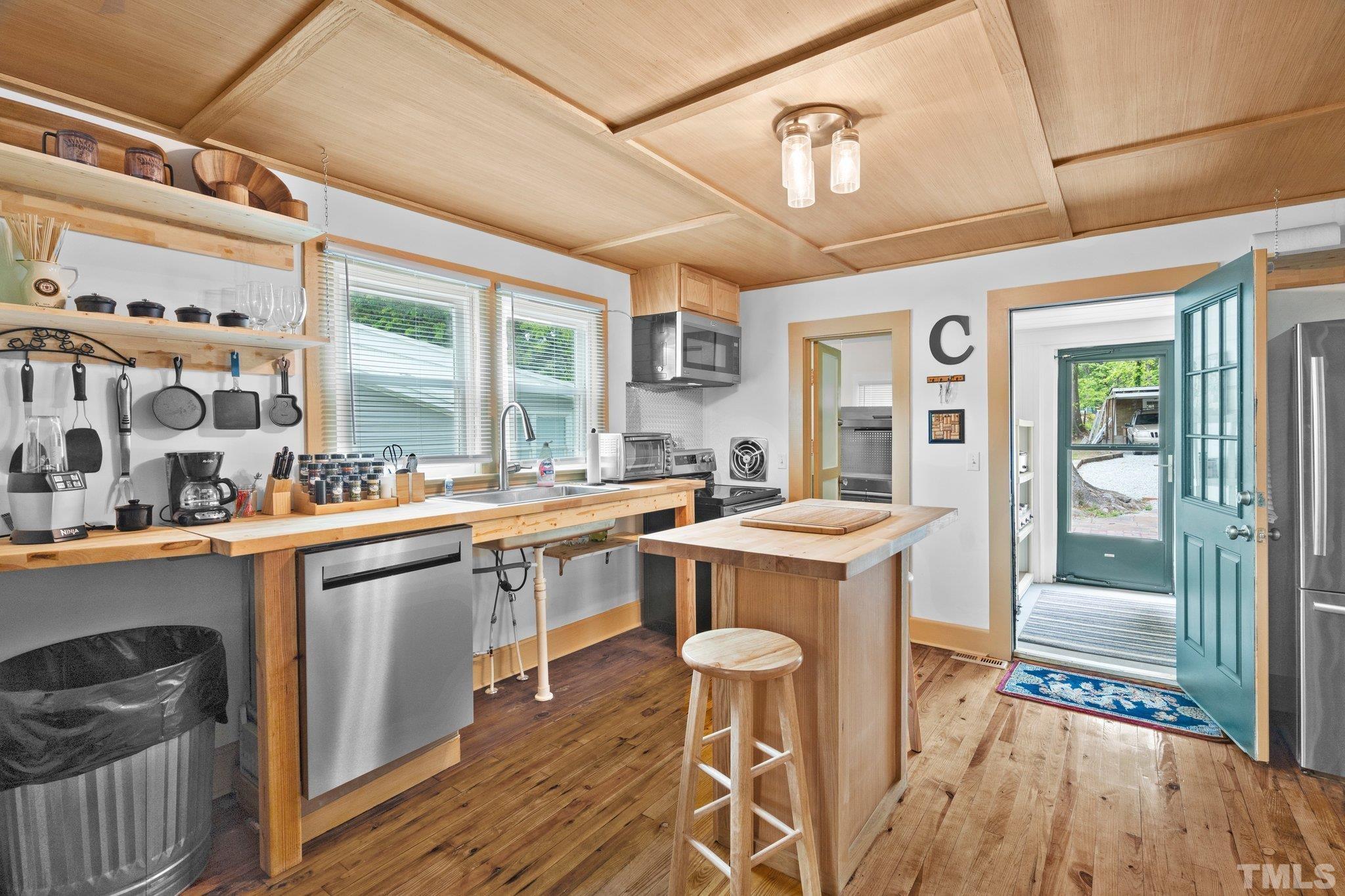 1263 Pointer Street Roxboro, NC 27573 - Photo 8 of 20 a kitchen with a sink appliances and cabinets