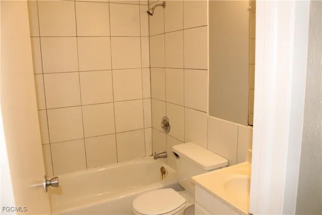 a bathroom with a bathtub and sink