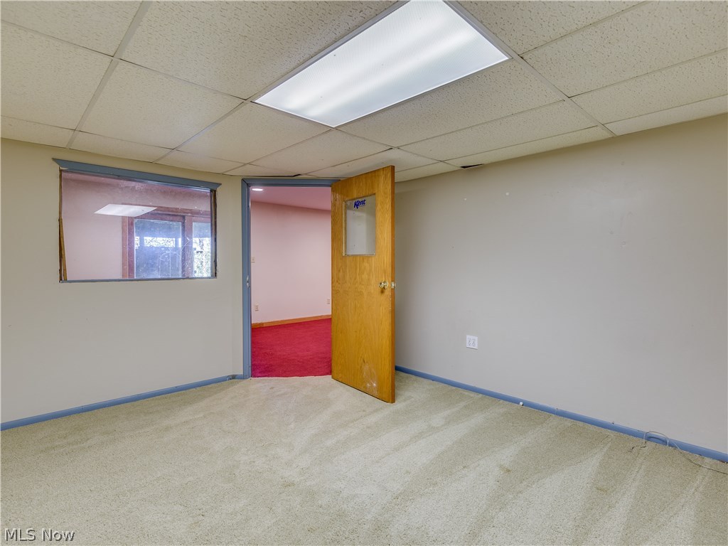6644 Red Brush Road Ravenna, OH 44266 - Photo 29 of 35 From the lower level office, you can see out to the rec room & sliders. Do you think you could use this space?