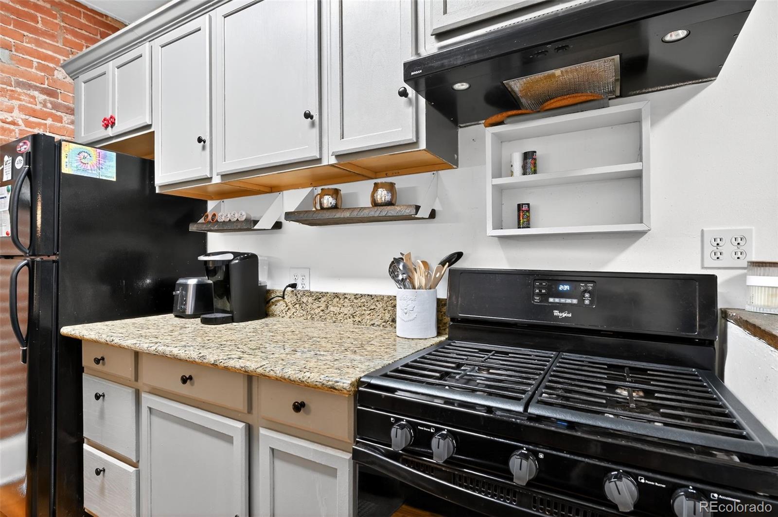 1608 Miner Street, Unit 2 Idaho Springs, CO 80452 - Photo 12 of 35 a close view of stove and cabinets