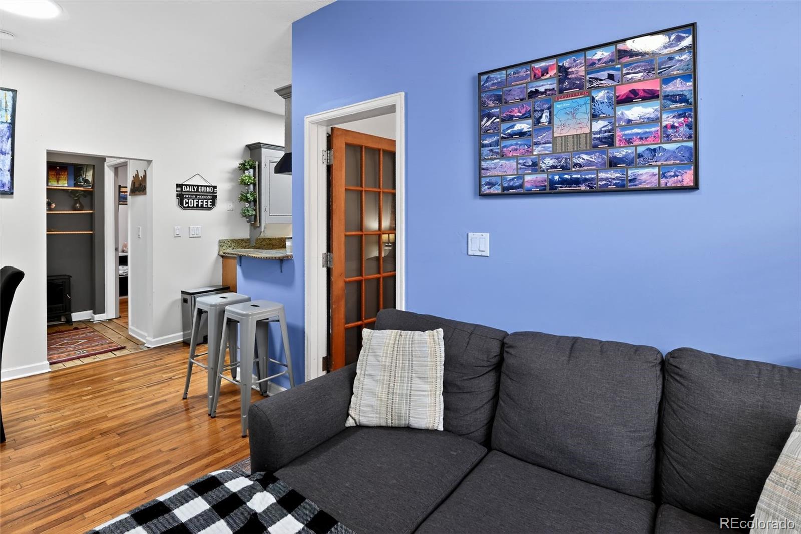 1608 Miner Street, Unit 2 Idaho Springs, CO 80452 - Photo 4 of 35 a living room with furniture and wooden floor