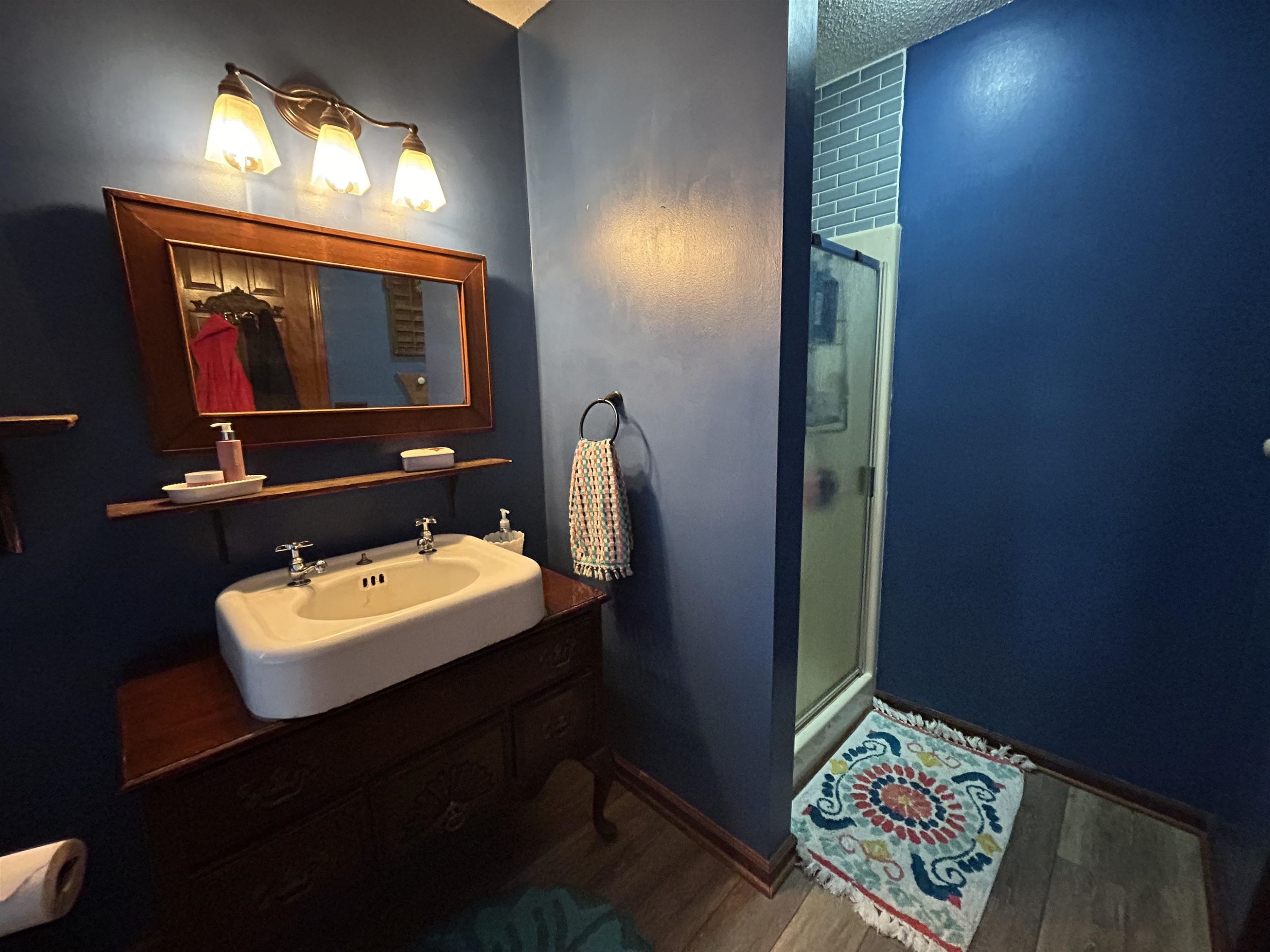 91 Violet Lane Coats, NC 27521 - Photo 14 of 19 a bathroom with a sink mirror and vanity