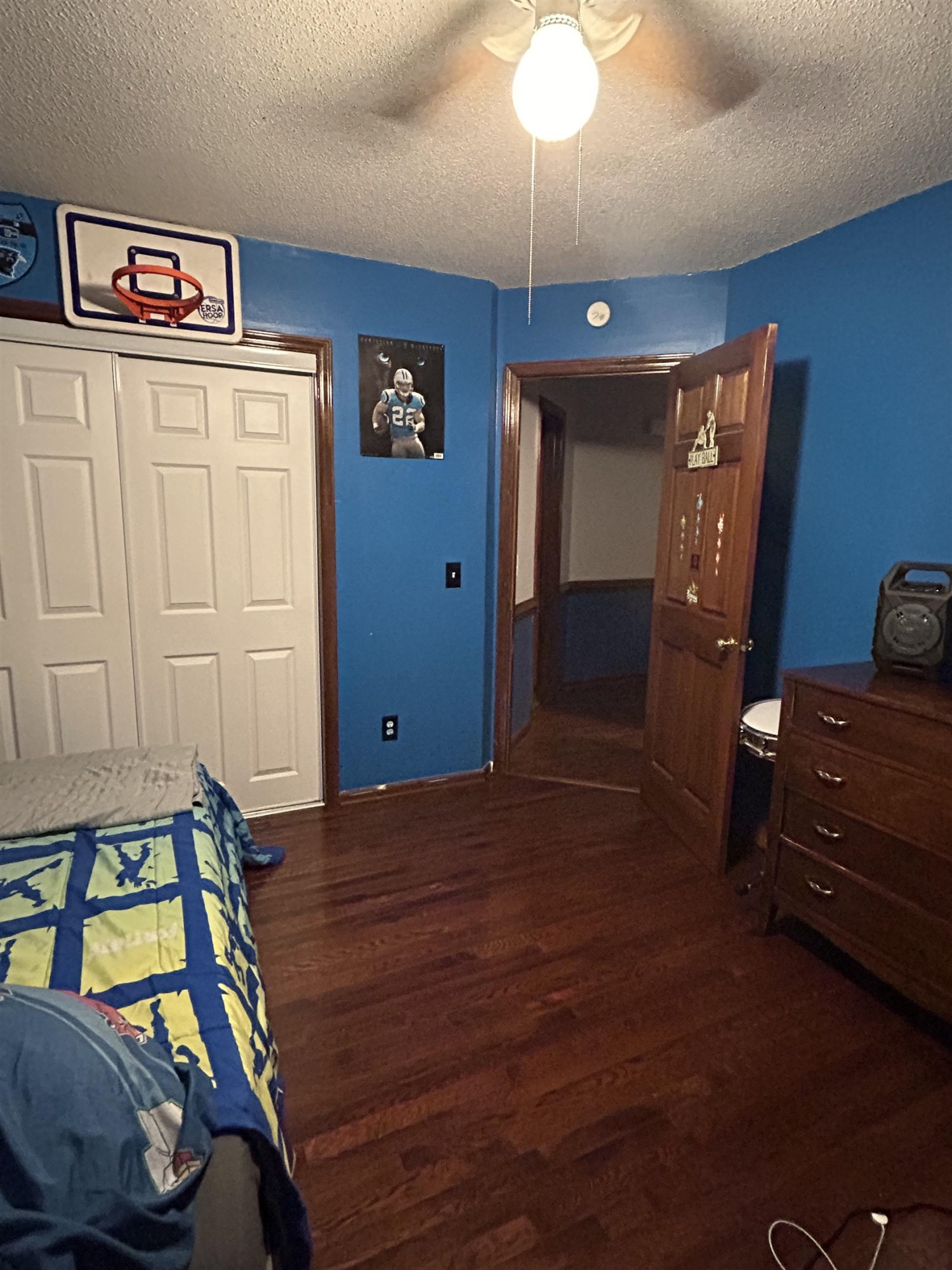 91 Violet Lane Coats, NC 27521 - Photo 17 of 19 a bedroom with furniture and a chandelier