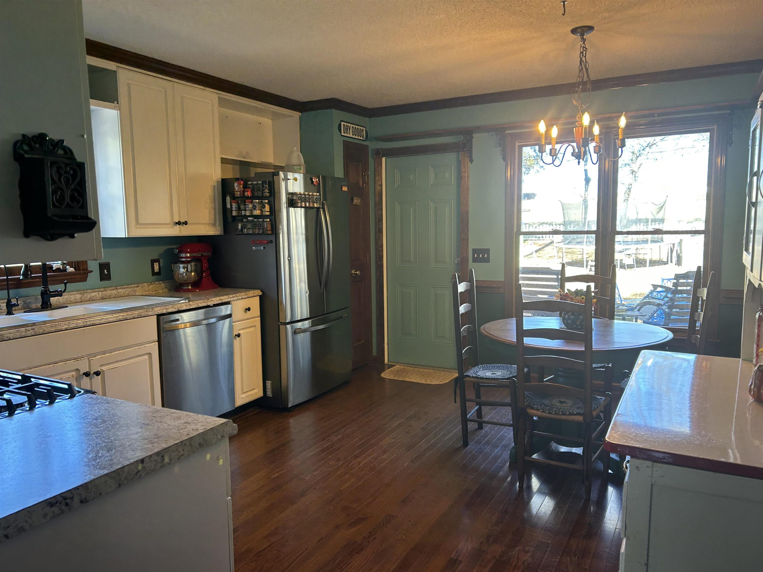 91 Violet Lane Coats, NC 27521 - Photo 7 of 19 a kitchen with sink cabinets and wooden floor