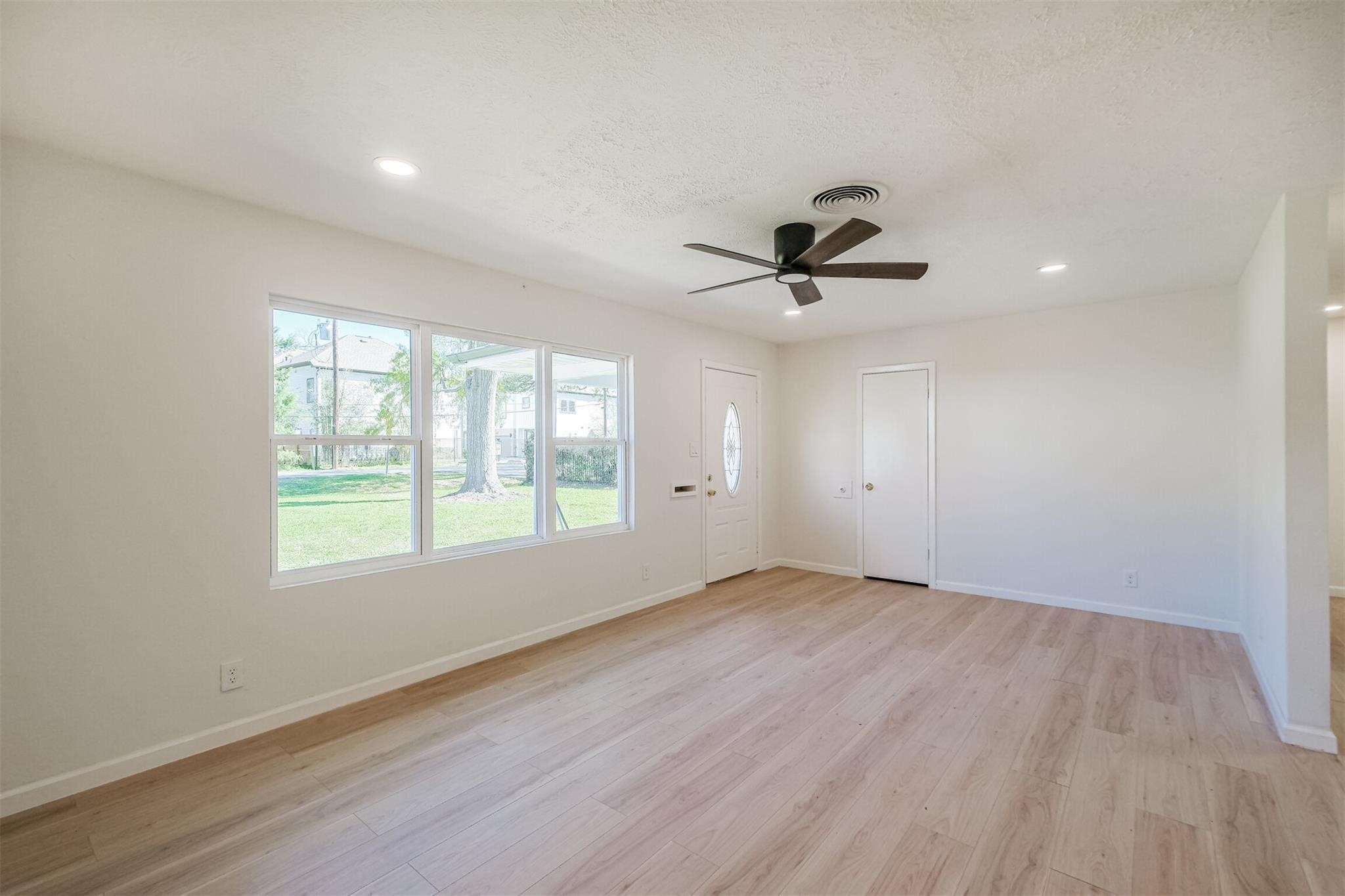 9419 Campbell Road Houston, TX 77080 - Photo 24 of 29 a view of an empty room with a window