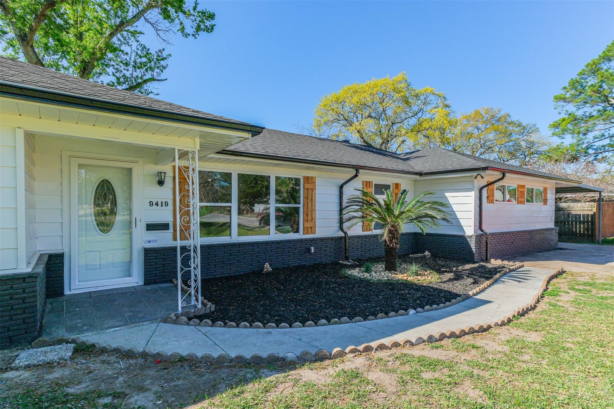 9419 Campbell Road Houston, TX 77080 - Photo 3 of 29 a view of a house with a tub and a porch