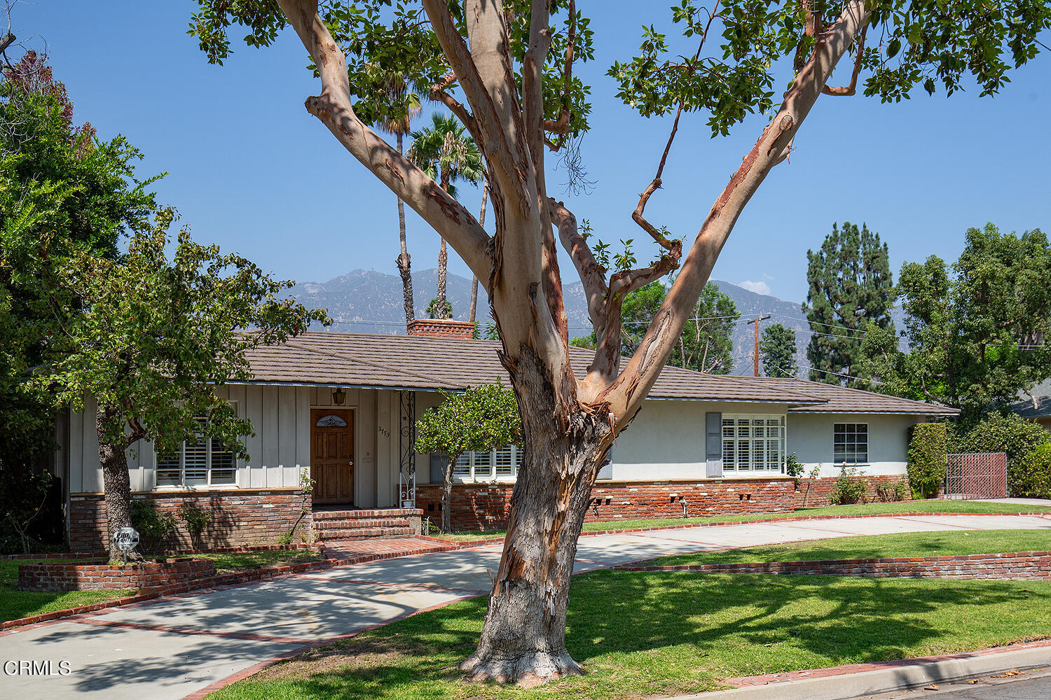 3775 Hampton Road Pasadena, CA 91107 - Photo 2 of 28 a front view of a house with garden and trees