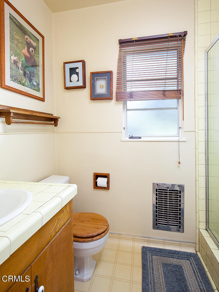 3775 Hampton Road Pasadena, CA 91107 - Photo 13 of 28 a bathroom with a toilet a sink and a window
