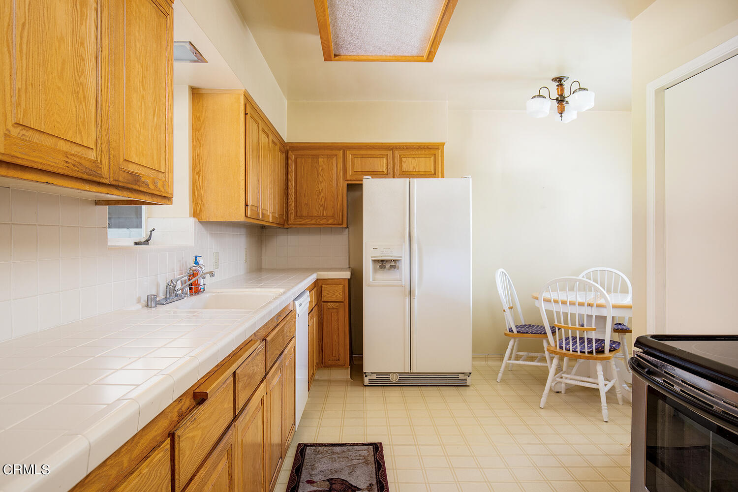 3775 Hampton Road Pasadena, CA 91107 - Photo 9 of 28 a kitchen with a refrigerator and a stove top oven