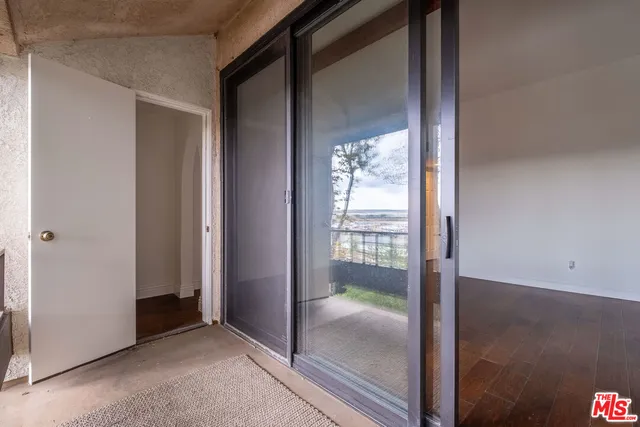 a backyard of a house with lots of green space and a fountain