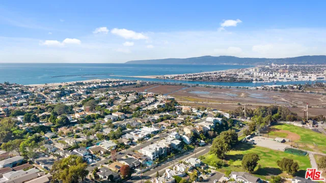 an aerial view of a house with outdoor space and street view