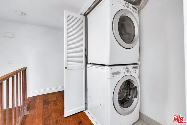 a view of a hallway with washer and dryer