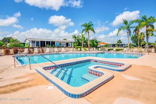 a view of swimming pool with outdoor seating