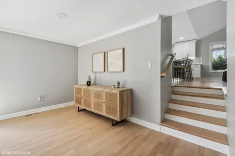 a view of a livingroom with furniture and a ceiling fan