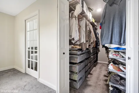 a bathroom with a shower sink vanity and toilet